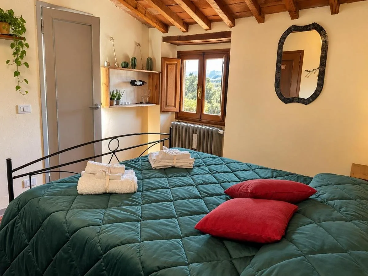 Camera Enjoy Comfort con soffitto in travi e cotto antico